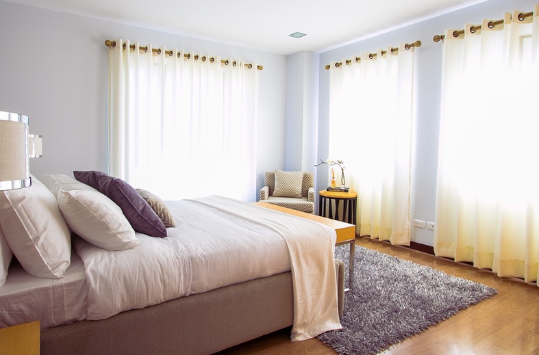 image showing beige themed bedroom during daytime