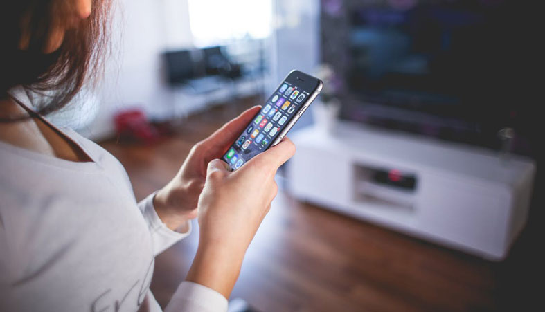 woman adjusts the application on the phone