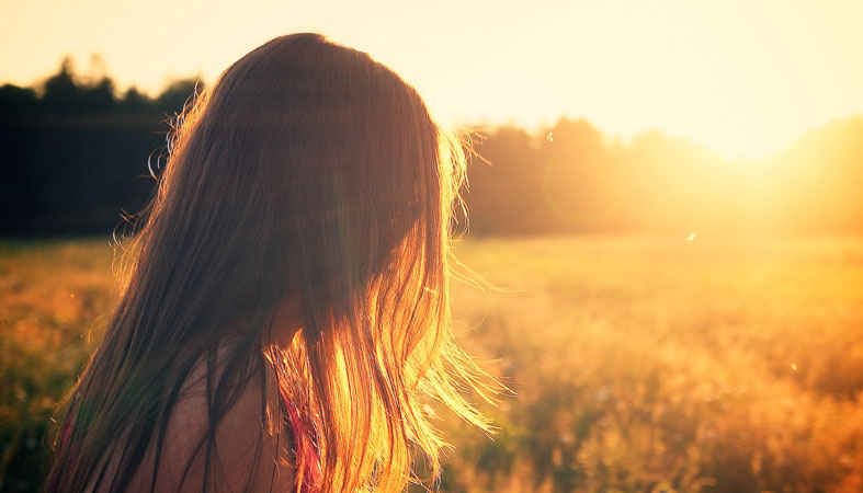 young girl enjoys the morning-outside