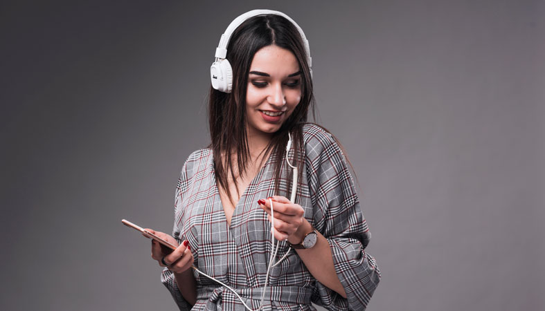 smiling woman is listening music
