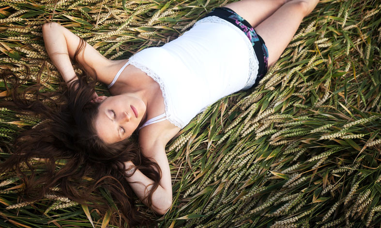 pregnant woman is sleeping on her back