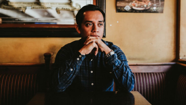 Man is sitting and thinking