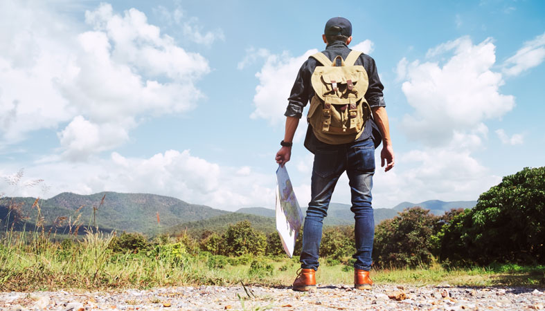 young-man-traveler-with-backpack-relaxing-outdoor young man traveler with backpack relaxing outdoor