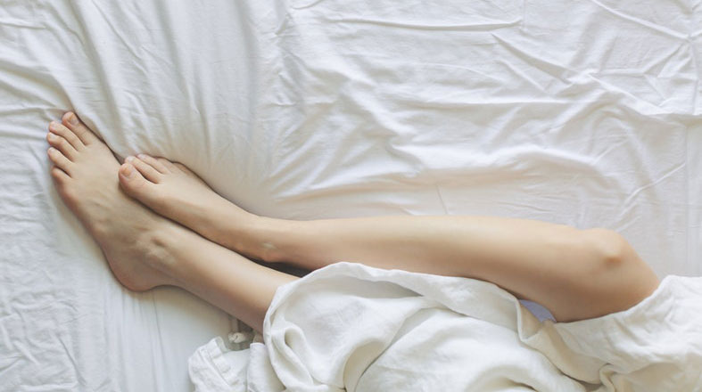 Legs on the bed