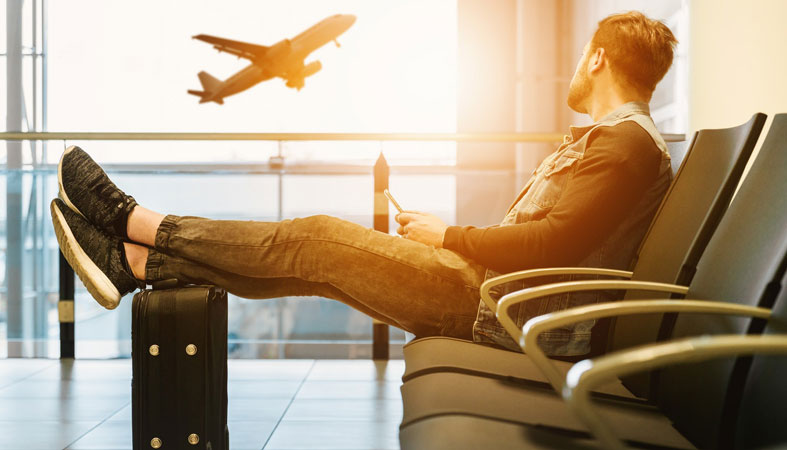 man at the airport look in the airplane