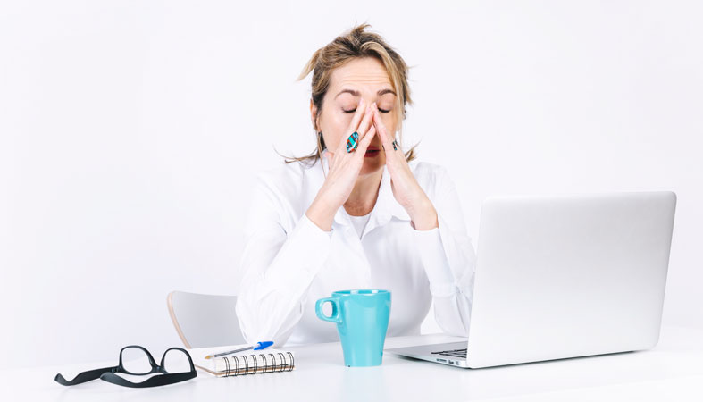 tired woman rubbing face