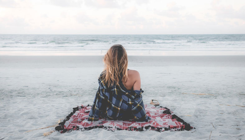 woman is relaxing on the beach