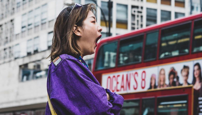 woman-in-purple-top-yawning woman in purple top yawning