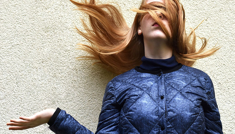 woman's-eyes-are-covered-with-her-reddish-hair woman's eyes are covered with her reddish hair