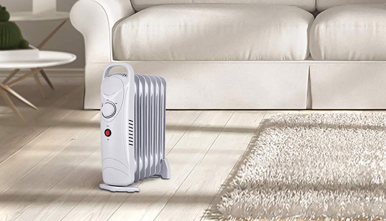 a living room with an oil heater