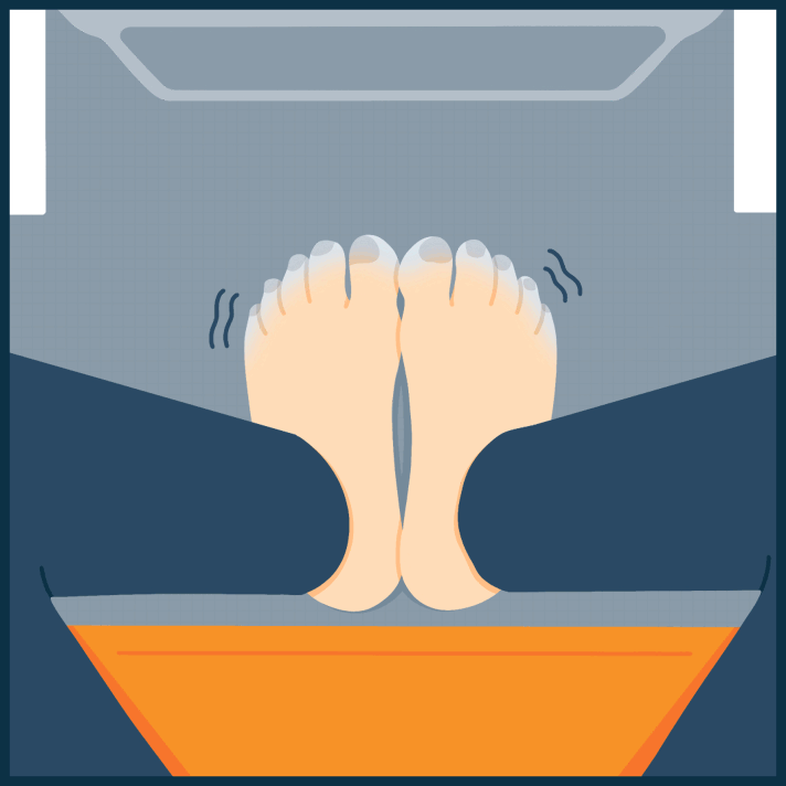 Someone in Their Seat Putting on Fuzzy Socks Animated Image