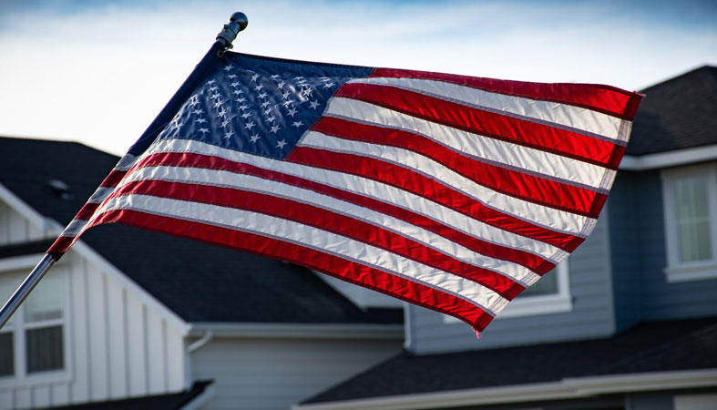 american flag in front of the house
