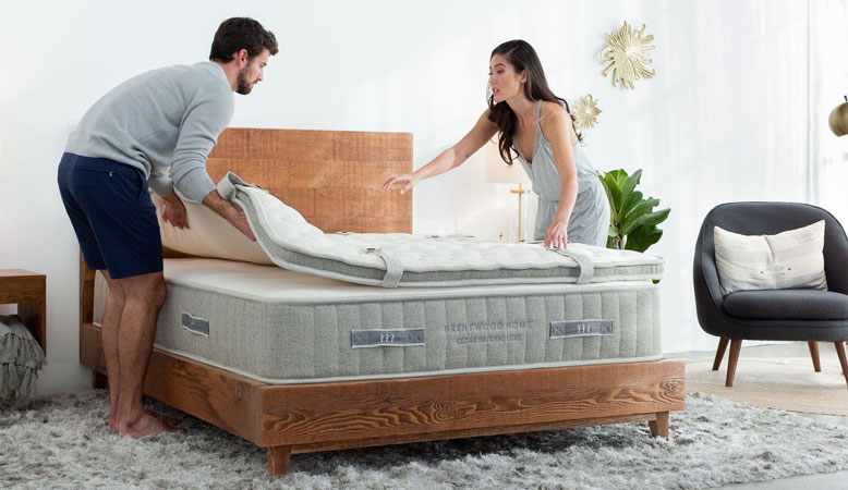 Product image of Brentwood Home bed showing a couple putting the top