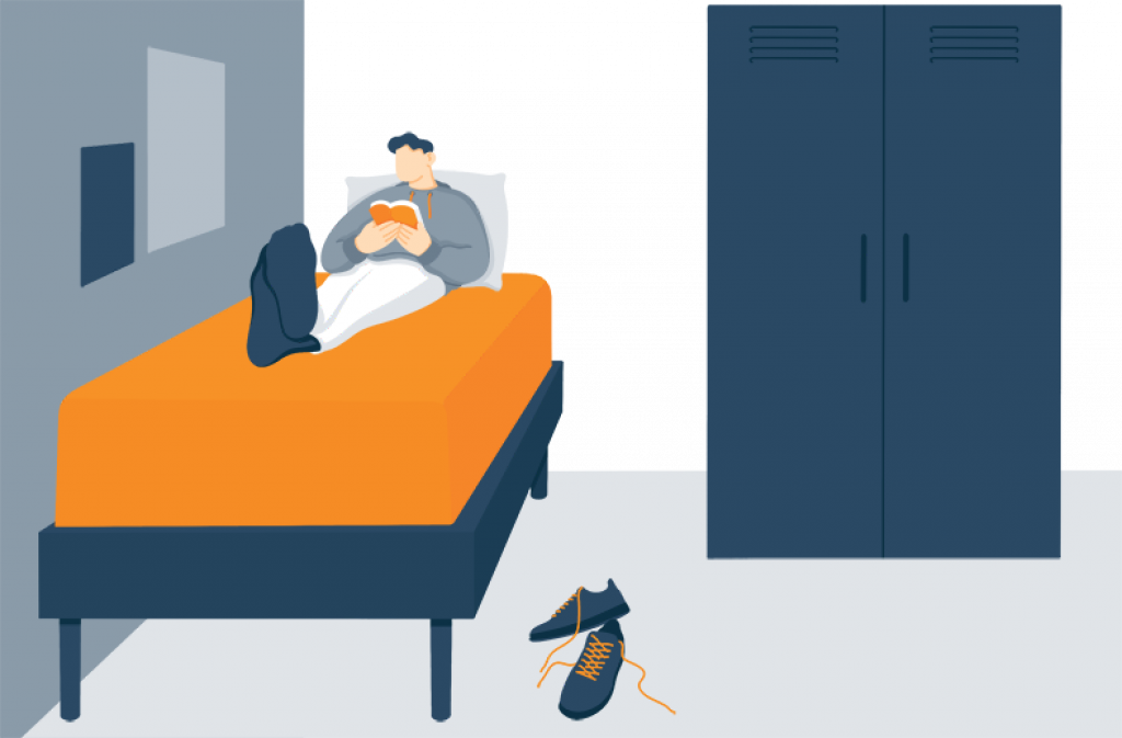 Illustration of a College Boy Reading a Book In His Dorm Room