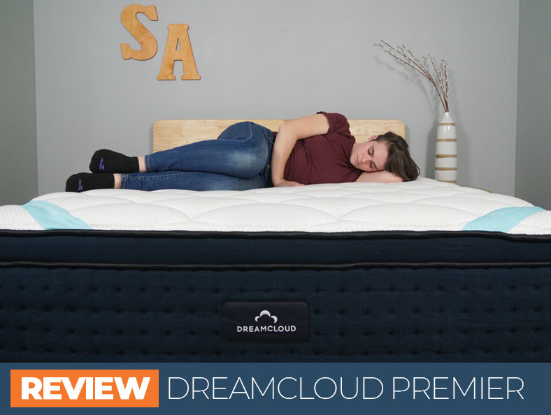 dreamcloud premier mattress review - image of Emma sleeping on the bed on the side