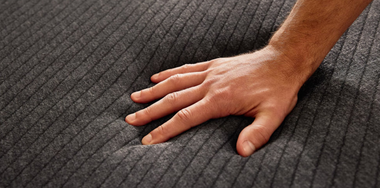 hand is pushing the pod mattress