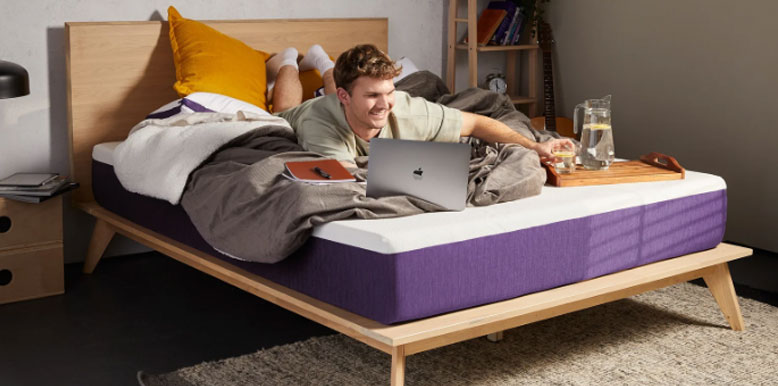 a-man-is-lying-on-his-stomach-on-his-polysleep-mattress a man is lying on his stomach on his polysleep mattress