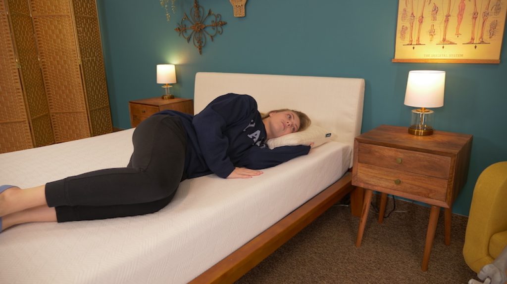 4th of July Mattress Sales - Deals and Discounts for 2025 55 Julia Forbes testing a mattress for side sleeping