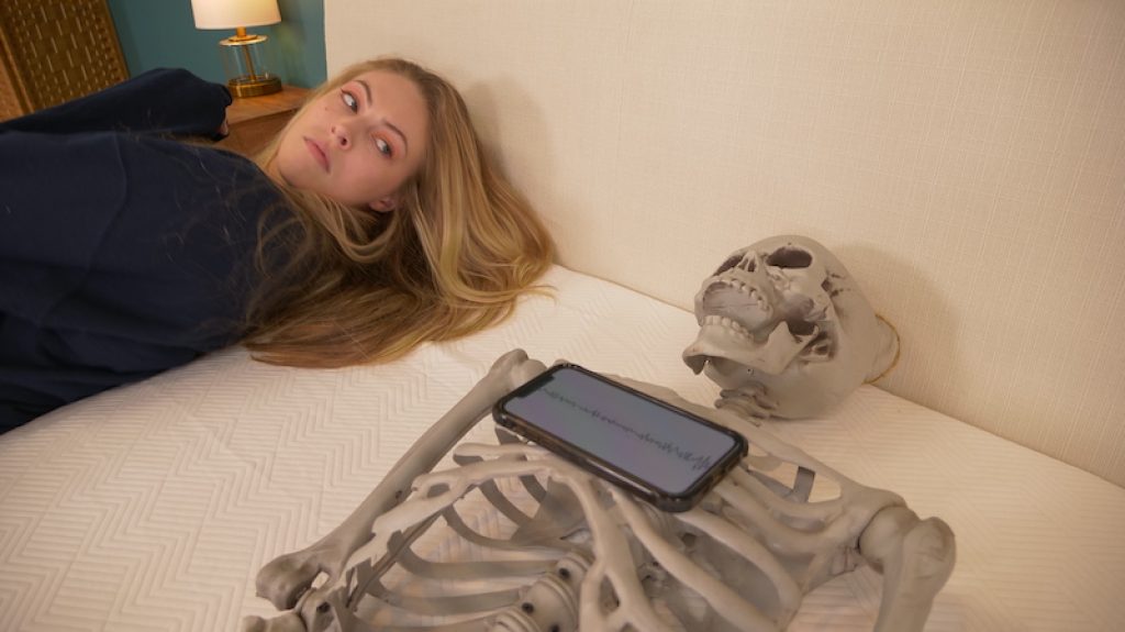 What is Motion Isolation and Why is it Important in a Mattress? 2 Julia Forbes testing motion transfer on a mattress