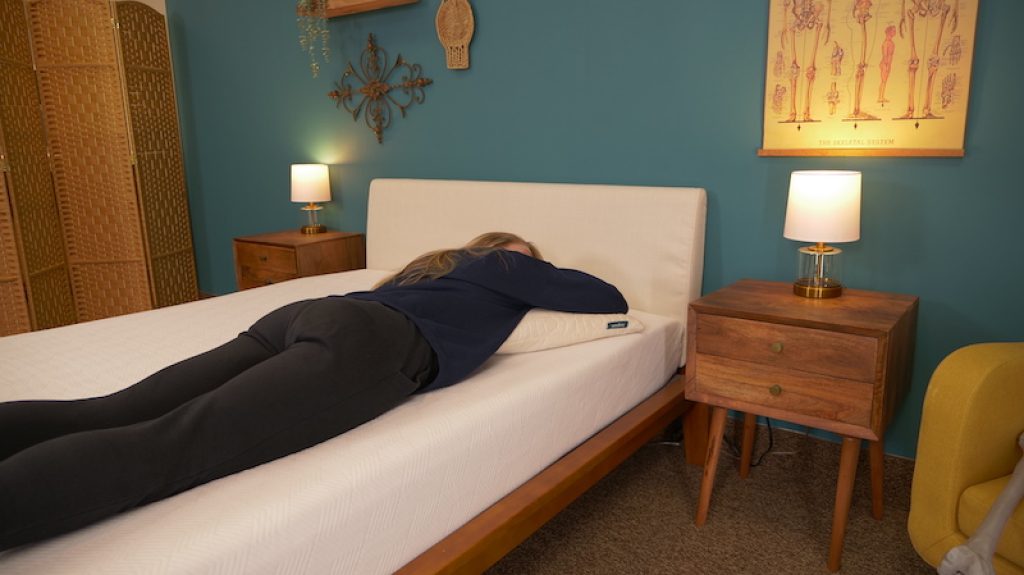 Our 6 Highest Rated Mattress Pads for 2025 - Expert Reviewed 9 Julia Forbes testing a mattress for stomach sleeping