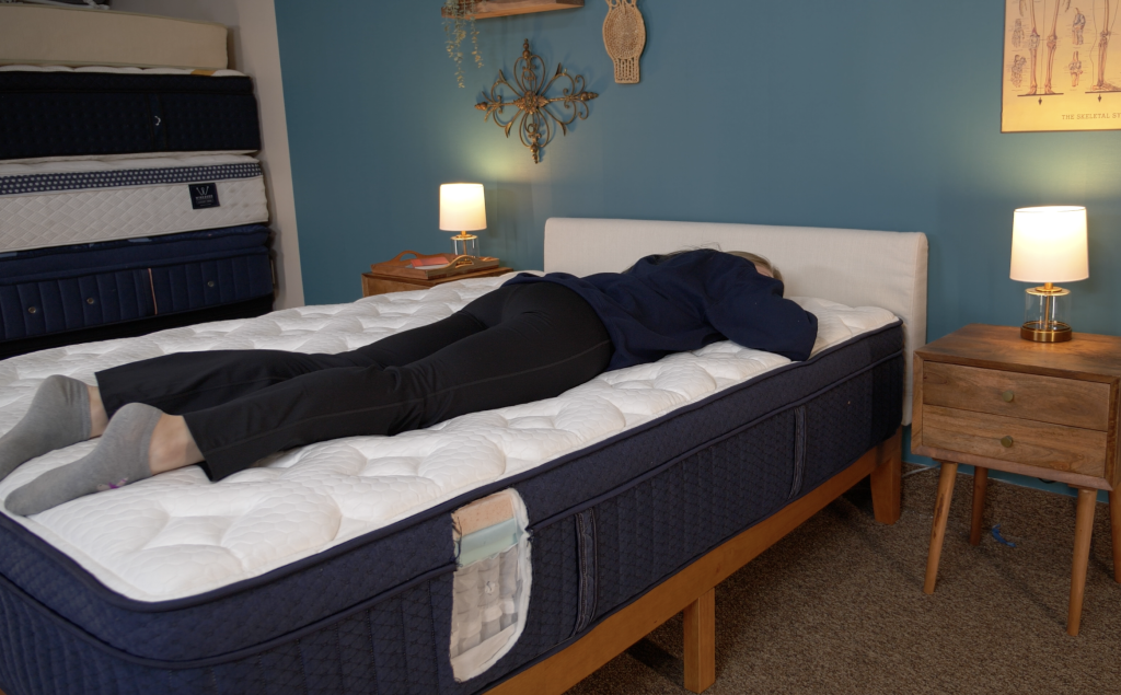 Mattress testing the Aurora Luxe in stomach sleeping position