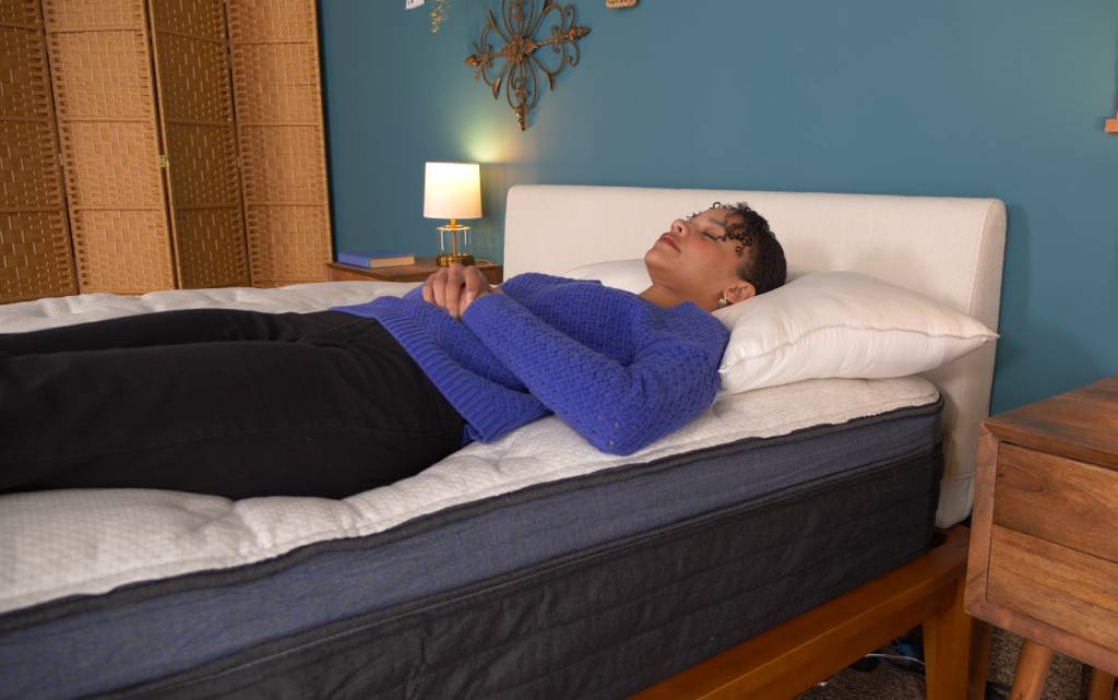 Helix Midnight Luxe Mattress Review (2025) 9 Our lead product tester Loren testing the Helix Midnight Luxe in various sleeping positions